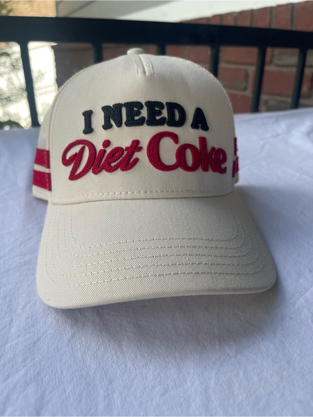 American Needle Cream Cap with Red and Black 'I Need A Diet Coke' Embroidery